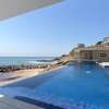 Appartement front de mer avec piscine à débordemen thumb 1