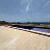 Villa neuve de 1000 m² pied dans l' eau Almadies thumb 12