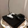 PS4 slim + 4 jeux thumb 1