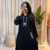 Robe longue sweat noire capuche poches confort thumb 0