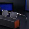 Lunettes de soleil noires dorées monture carrée UV thumb 0