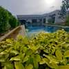Villa moderne avec piscine privée et jardin paysager thumb 0