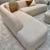 Canapé d'angle blanc cassé avec pouf orange design thumb 2