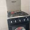 Nexon cuisinière gaz 4 feux noir avec four thumb 1