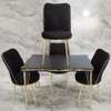Ensemble table et 4 chaises noir et doré moderne thumb 0