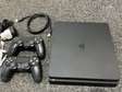 PS4 Slim flashé 1téra + 14jeux
