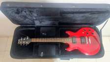 Guitare électrique rouge manche bois clair