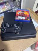 PlayStation 4 Slim une manette et Cd