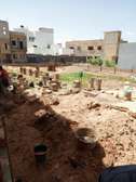 Terrain avec fondation R+3 à vendre à la Cité Hawa Dia