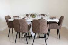 Table à manger design + 6 chaises en cuir — Comme neuve