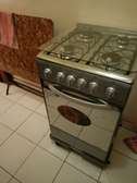 Cuisinière à gaz inox 4 brûleurs avec four intégré