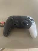 Nintendo Switch Pro manette noir et blanc avec jeu