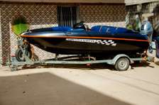 Bateau gonflable 4 places bleu-orange avec rames et gilets
