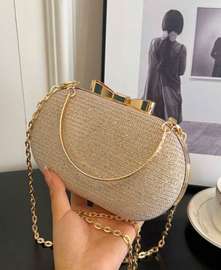 Sac de soirée doré chaîne fine nœud déco