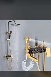Colonne de douche thermostatique dorée avec douchette