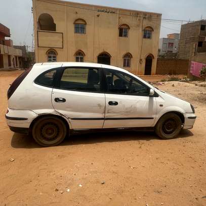 Opel Almera berline compacte essence blanche image 3