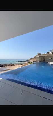 Appartement front de mer avec piscine à débordemen image 2