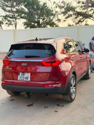 Kia Sportage SUV compact rouge dynamique image 5
