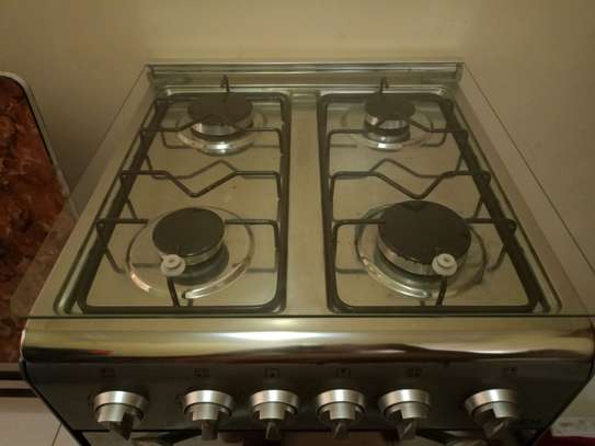 Cuisinière à gaz inox 4 brûleurs avec four intégré image 2