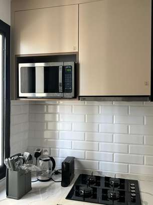 À vendre – F2 neuf de standing entièrement meublé au Point E image 13
