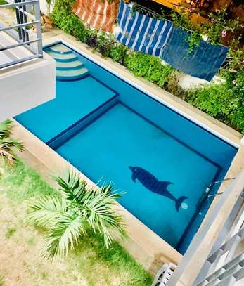 Appartement moderne avec piscine privée et jardin sécurisé image 8