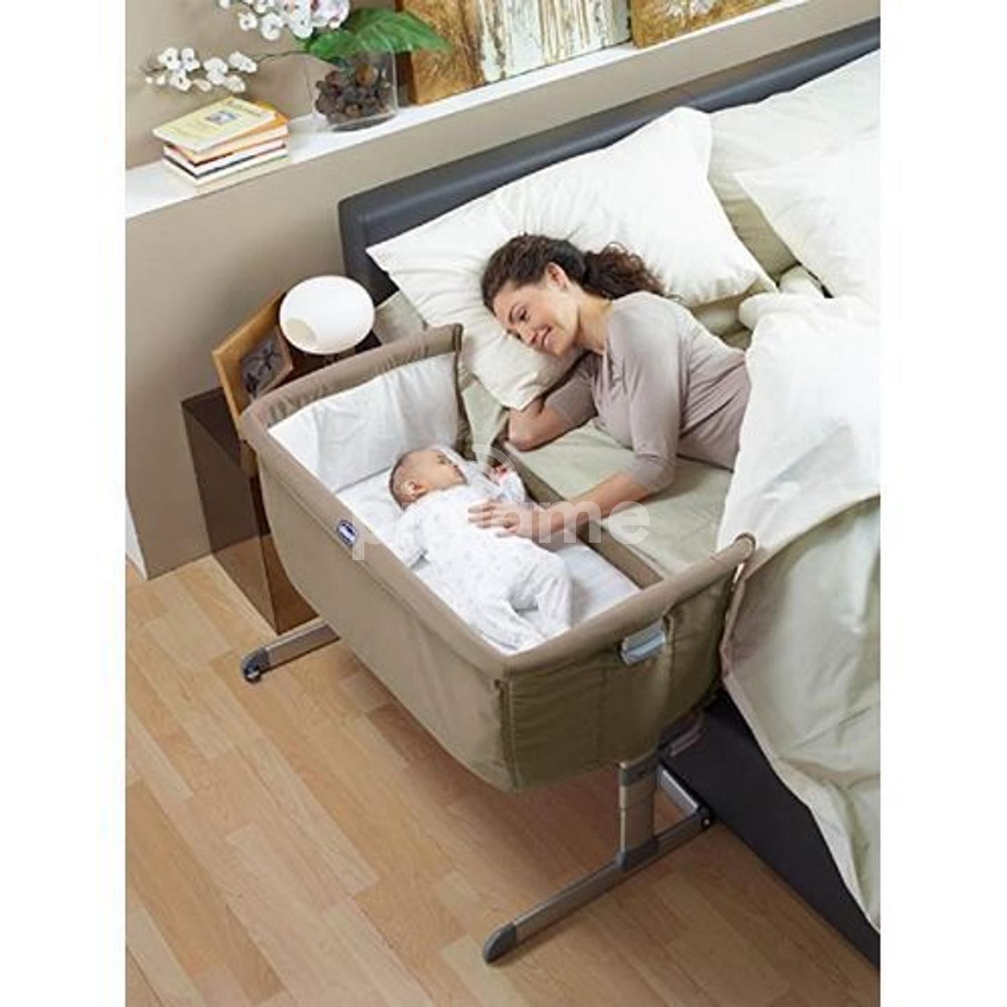 baby bed on side of bed
