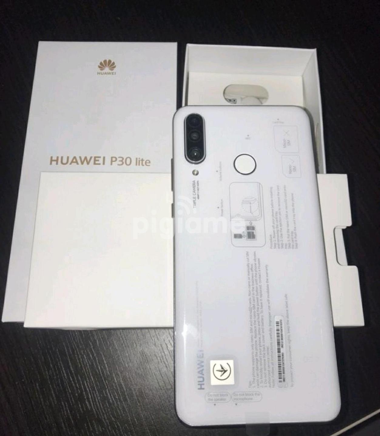 huawei p30 lite 128 gigabytes with charging pad