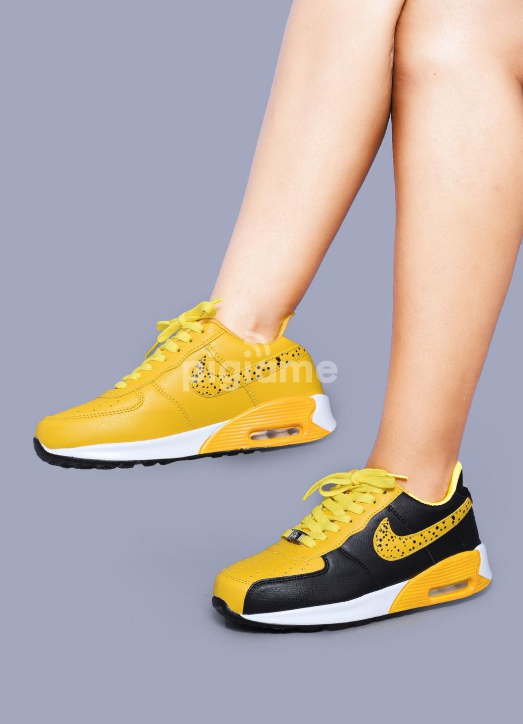 Nike on sale thea yellow