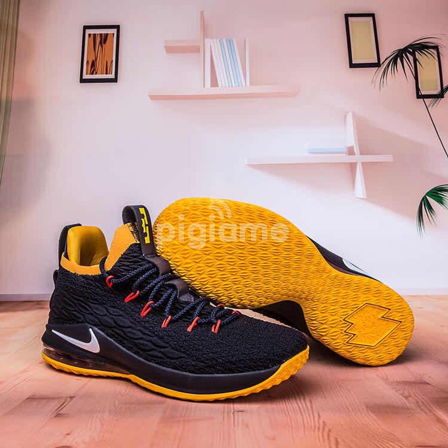 black and yellow lebron shoes