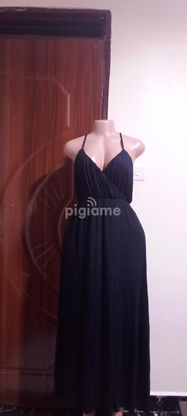 Elegant Black Halter Neck Maxi Dress Flowy Silhouette in Ruiru | PigiaMe Elegant Black Halter Neck Maxi Dress Flowy Silhouette in Ruiru | PigiaMe
