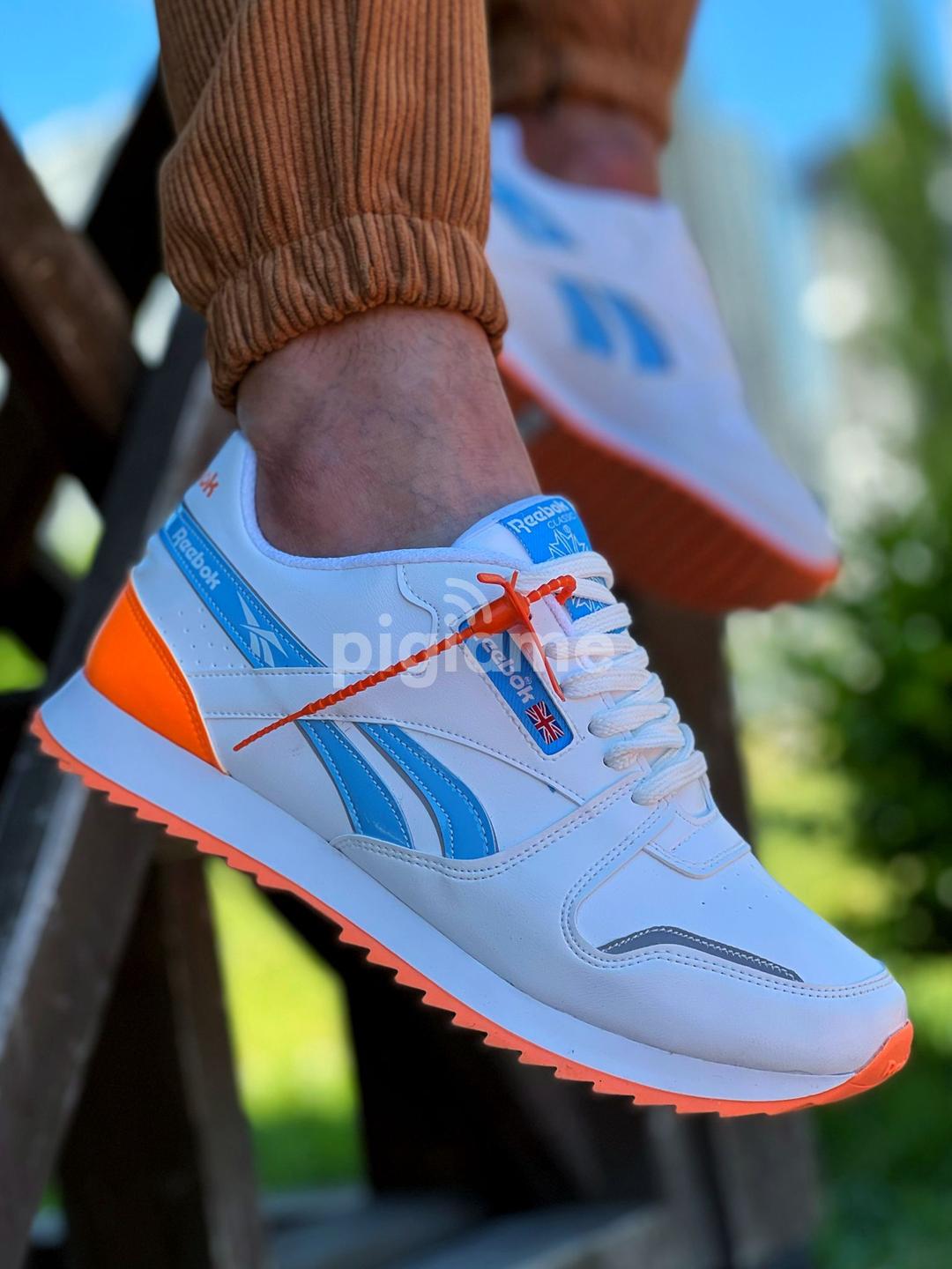 Orange and top blue reebok classics