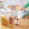Cereal  Storage Container with measuring cup and handle thumb 2