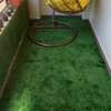 Relaxing area well fitted in artificial grass carpet thumb 1