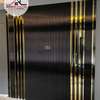 Black flutted panels with gold strip tape interior design thumb 2