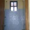 Compact Shower Cabin with Tiled Walls & Faucet thumb 0