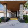 Modern Home with Stone Pillars & Large Windows thumb 0