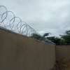 wall top electric fencing installation in kenya thumb 9