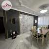 Black flutted panels with granite center interior design thumb 2