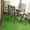 A verdant relaxing area fitted with artificial grass carpet thumb 0