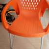 Plastic chair with metallic tubing legs. thumb 4