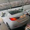 Mazda Demio sedan white thumb 1