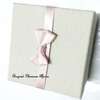 Grey cardboard gift box with pink ribbon thumb 0