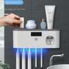 Electric toothbrush UV sterilization dispenser thumb 0