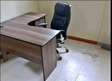Laptop office desk with a chair