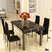 Black dining table with a set of chairs