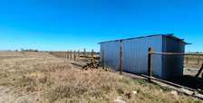 1/2 acre in exchange with a car