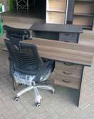 Office chair with a headrest and a work table