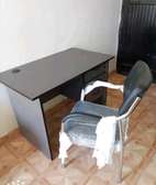 Greyish office desk plus non -rotatable chair
