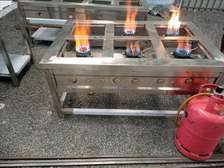 Six burner jiko with high pressure controller taps