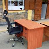 High back chair with a headrest plus a work table